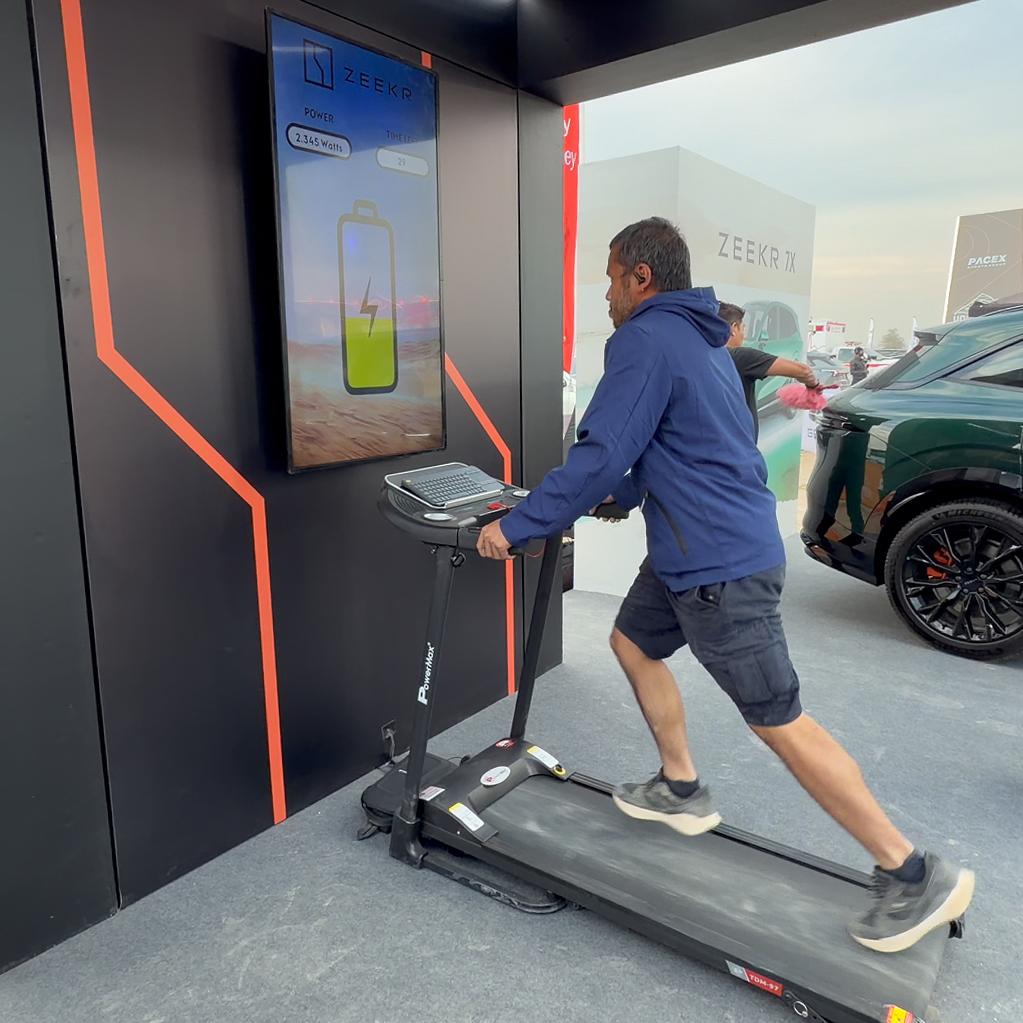 Interactive Treadmill Activation in Dubai: Participants generating human power to recharge EV cars